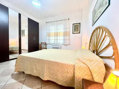 Letto o letti in una camera di La Margherita