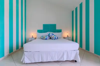 Letto o letti in una camera di Casa Pintada Porto Pino, 500 mt to beach SouthSardiniaHolidays