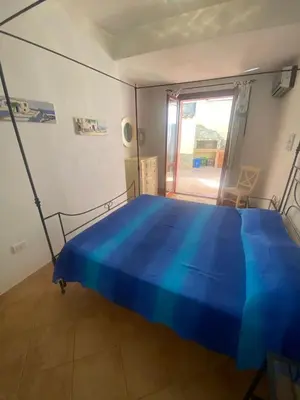 Letto o letti in una camera di Casa Vacanza NikyPaola Villasimius