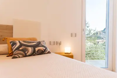Letto o letti in una camera di Camere in villa da Anna, Poggio dei Pini