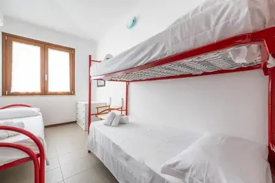 Letto o letti in una camera di Casa Azalea