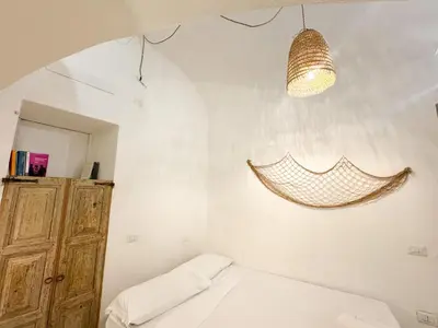 Letto o letti in una camera di Kalma - Genovesi mini house