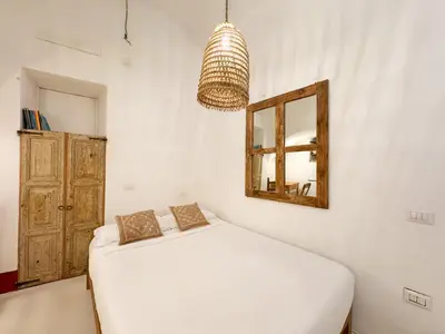 Letto o letti in una camera di Kalma - Genovesi mini house
