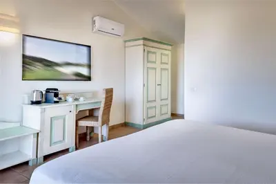 Letto o letti in una camera di Veridia Resort Sardinia, a member of Radisson Individuals