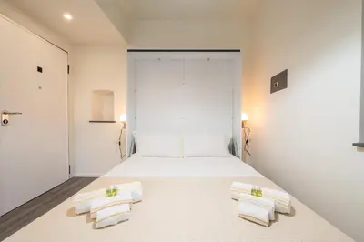 Letto o letti in una camera di Lumen City Vibes