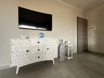 TV o dispositivi per l'intrattenimento presso Apartment Villasimius Rebecca House