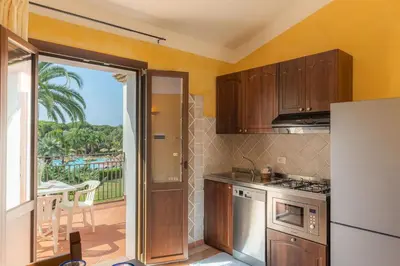 Cucina o angolo cottura di Tropical Residence In Santa Margherita Di Pula