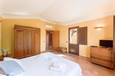 Letto o letti in una camera di Tropical Residence In Santa Margherita Di Pula
