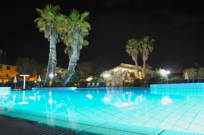 Piscina di Hotel surrounded by greenery with swimming pool in Arborea just 600 meters from the sea o nelle vicinanze