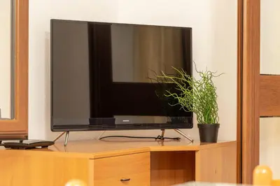 TV o dispositivi per l'intrattenimento presso Casa Sa Montera A - appartamento con balcone