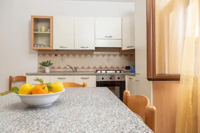 Cucina o angolo cottura di Casa Sa Montera A - appartamento con balcone