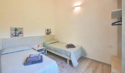 Letto o letti in una camera di Villa Corallo