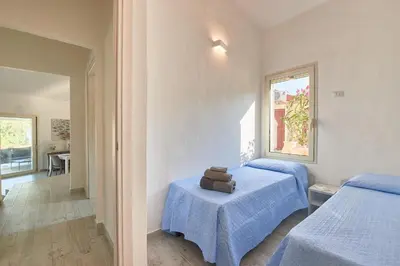 Letto o letti in una camera di Villa Corallo