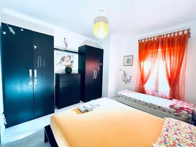 Letto o letti in una camera di Casa vacanze alla Maddalena Spiaggia