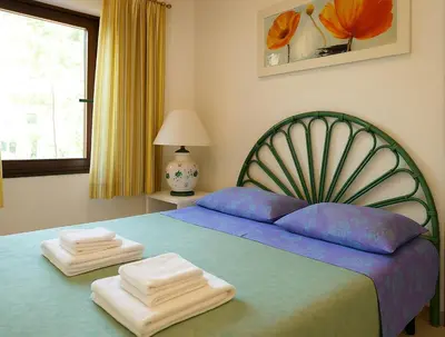 Letto o letti in una camera di B&B Nel Giardino In Fiore
