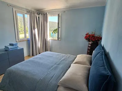 Letto o letti in una camera di Villa Alba