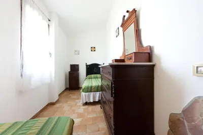 Letto o letti in una camera di Villa Domo Sardo