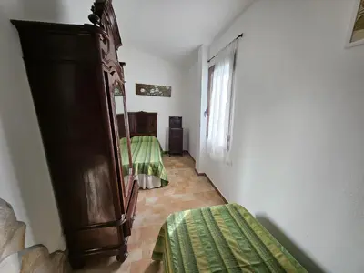 Letto o letti in una camera di Villa Domo Sardo