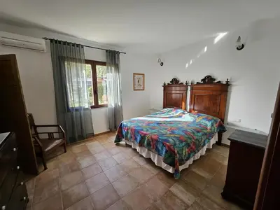 Letto o letti in una camera di Villa Domo Sardo