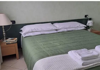 Letto o letti in una camera di Casa Corallina