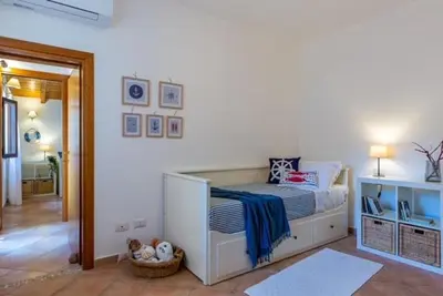 Letto o letti in una camera di Casa Annette By La Via Del Mare Viaggi e Vacanze