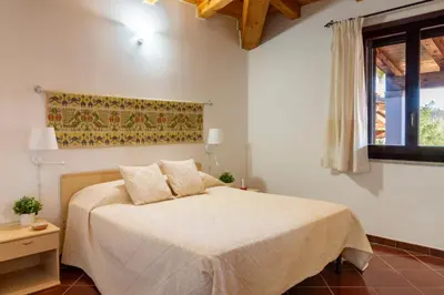 Letto o letti in una camera di Residenza Melissa, appartamenti