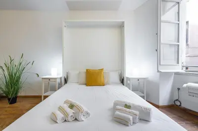 Letto o letti in una camera di LUMEN Old Town Loft