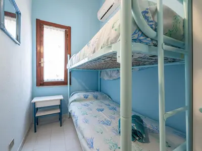 Letto o letti a castello in una camera di Villetta Valentina vista mare Bestvacationever