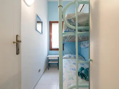 Letto o letti in una camera di Villetta Valentina vista mare Bestvacationever