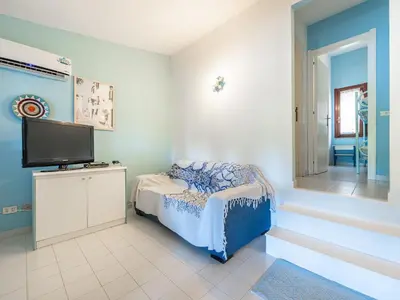 TV o dispositivi per l'intrattenimento presso Villetta Valentina vista mare Bestvacationever