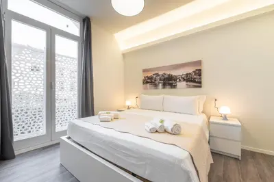 Letto o letti in una camera di Lumen - Downtown Vibes