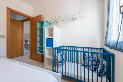 Letto o letti in una camera di Domo Coro e Bentu