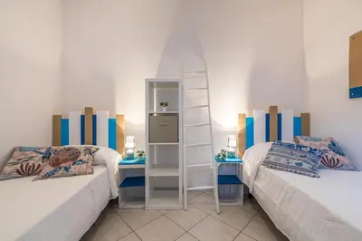 Letto o letti in una camera di Domo Coro e Bentu