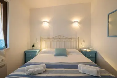 Letto o letti in una camera di 2 minutes' walk from the sea- cozy ande full-equipped house