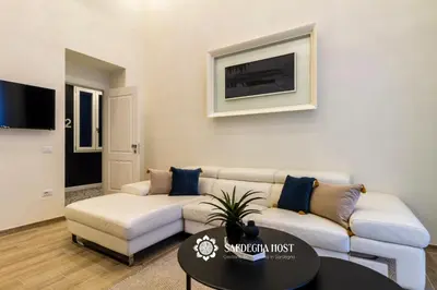 Area soggiorno di Sardegna Host Suite Brezza Marina