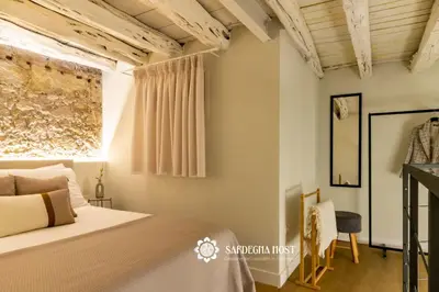 Letto o letti in una camera di Sardegna Host Il Nido