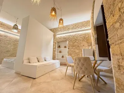 TV o dispositivi per l'intrattenimento presso Kalma Villanova - Stone Elegance in the Old Town