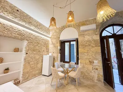 Area soggiorno di Kalma Villanova - Stone Elegance in the Old Town