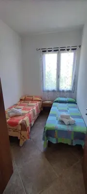 Letto o letti in una camera di Sa Domu De Pardinu
