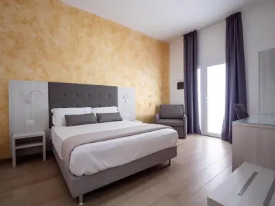 Letto o letti in una camera di Corte dei Limoni - Affittacamere - Living Sant'Antioco
