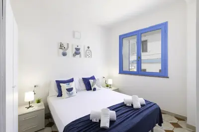 Letto o letti in una camera di La Vela bianca