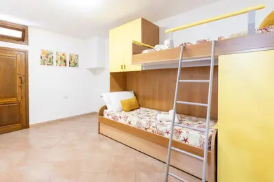 Letto o letti in una camera di Villa Baia del corallo