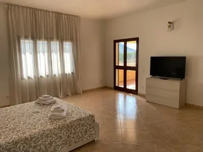 Letto o letti in una camera di Bellavista