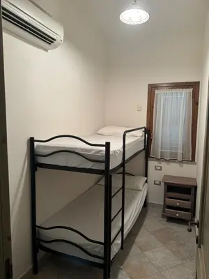 Letto o letti in una camera di Villetta a schiera frontemare