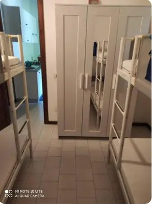Letto o letti a castello in una camera di Geremeas Residence villetta le palme