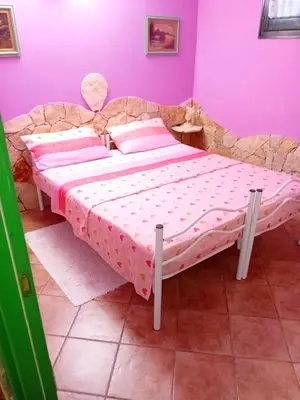 Letto o letti in una camera di Villa Atzori