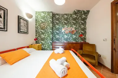 Letto o letti in una camera di Villa Melita