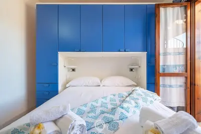 Letto o letti in una camera di La perla nel blu