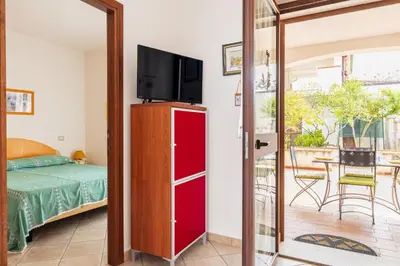 Letto o letti in una camera di Casa Vacanze Marconi a DONIGALA