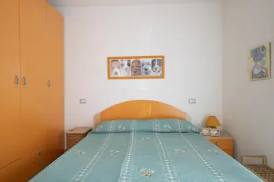 Letto o letti in una camera di Casa Vacanze Marconi a DONIGALA